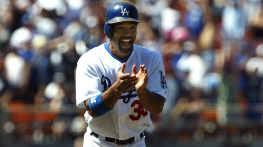 LOS ANGELES - JULY 11: Dave Roberts #30 of the Los Angeles Dodgers celebrates as he runs home to score on Paul Lo Duca's grand slam home run in the eighth inning against the Houston Astros on July 11, 2004 at Dodger Stadium in Los Angeles, California. (Photo by Stephen Dunn/Getty Images)